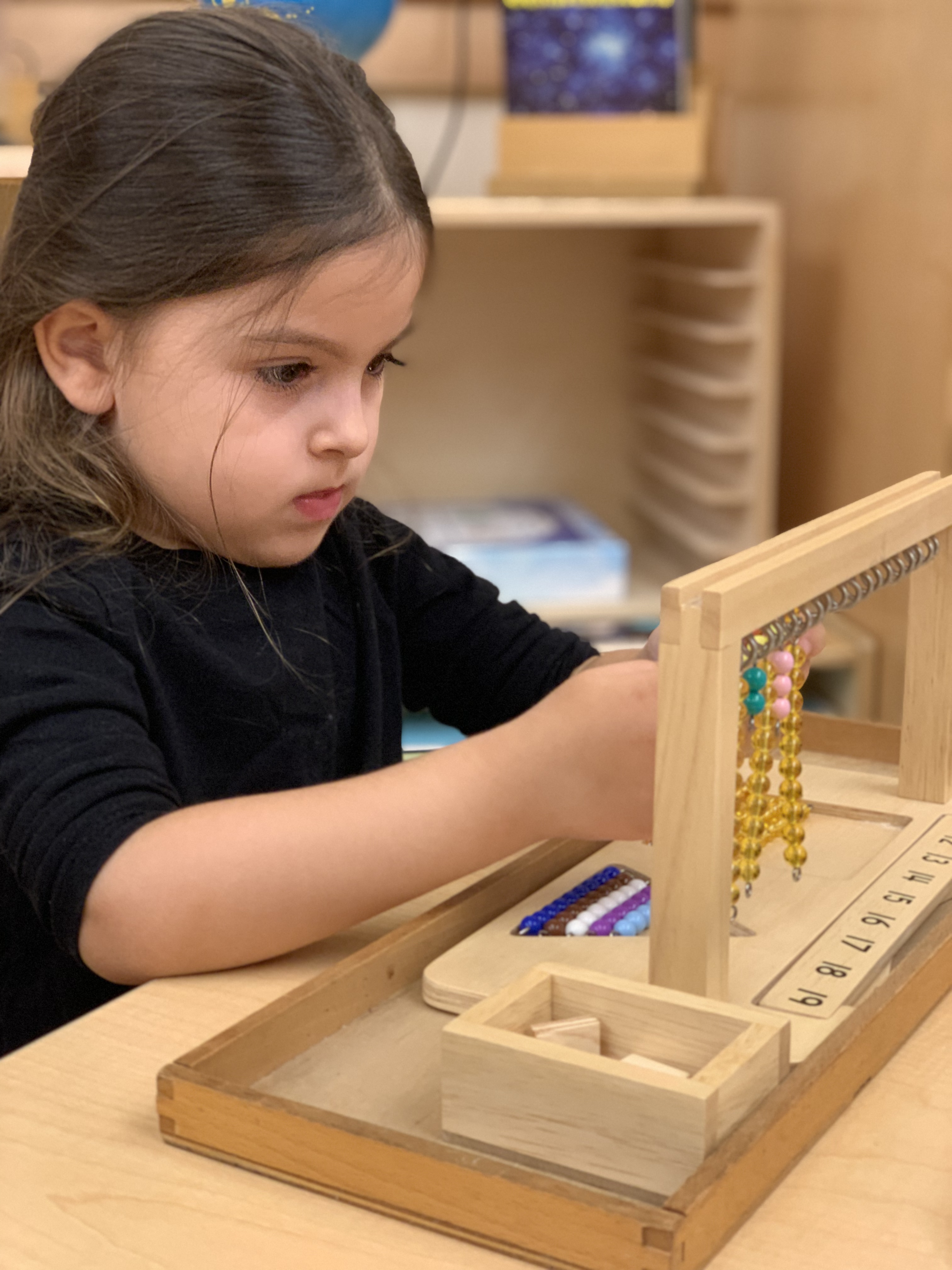 Young students learning in a Montessori way