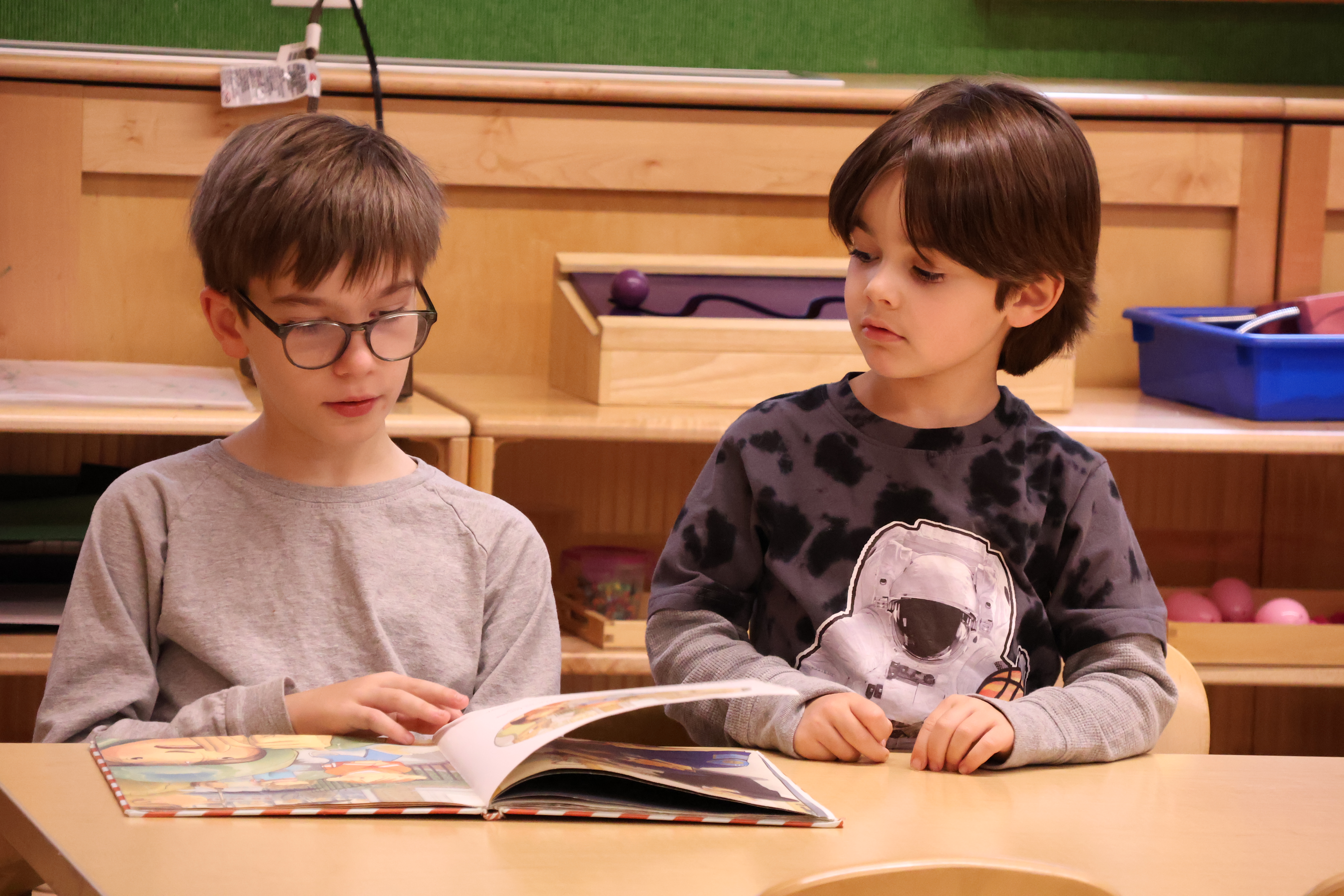 Caedmon pupils reading a book